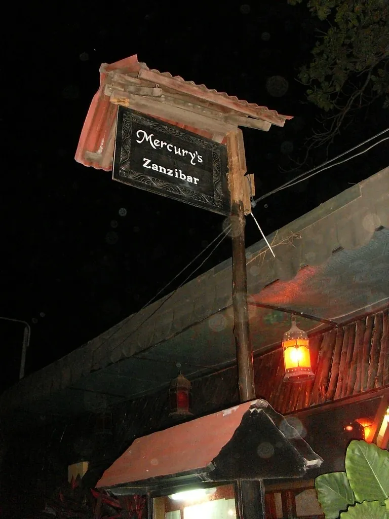 The Mercury's Zanzibar sign lit up at night