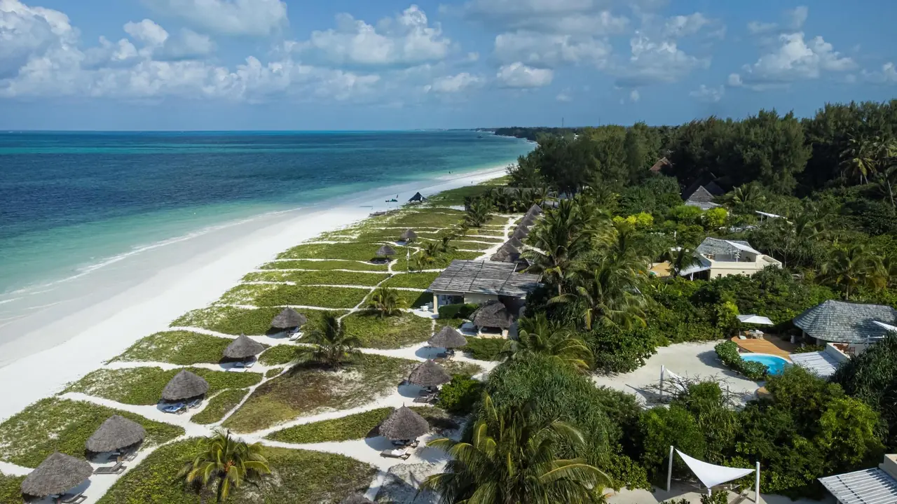 Aerial view of the villas and gardens along Paje's white beach