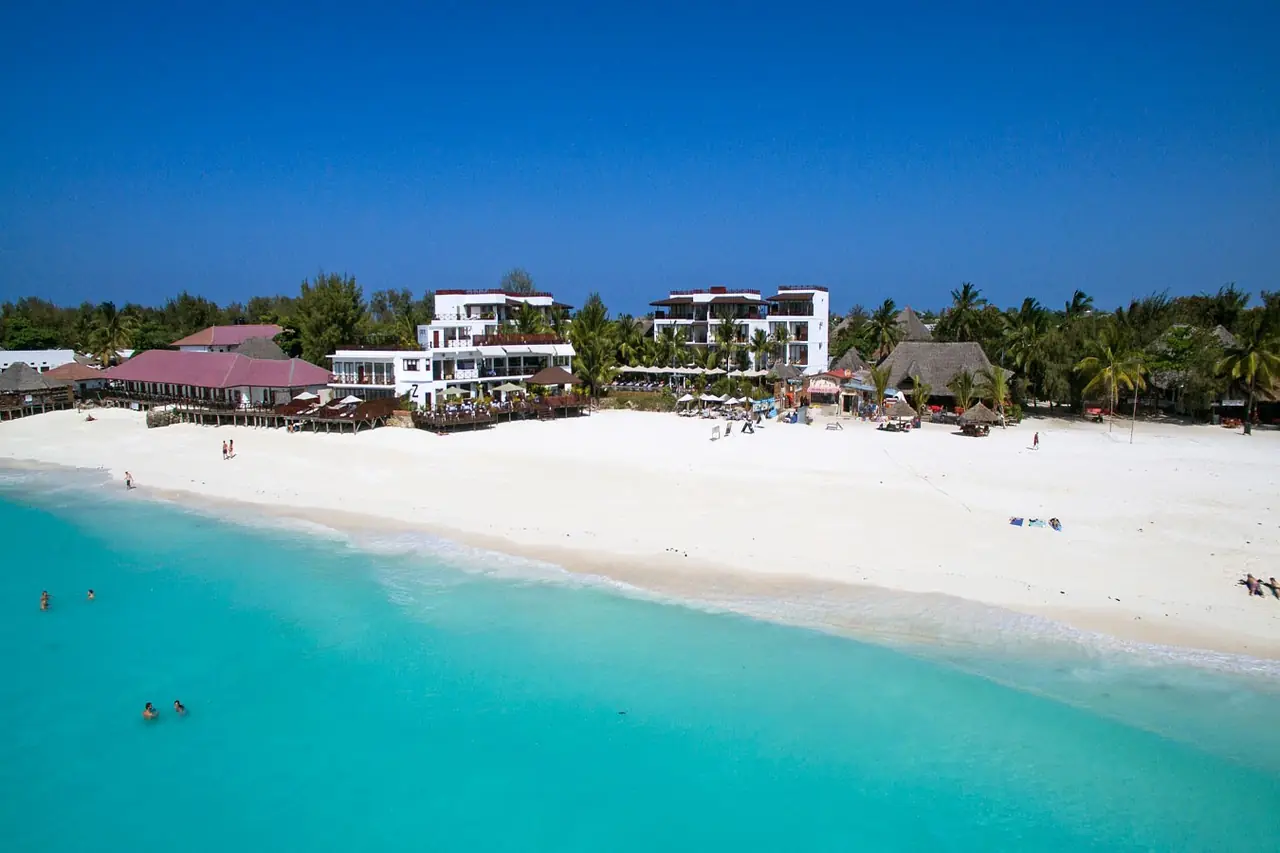 The hotel's white buildings on Nungwi's white beach above turquoise water