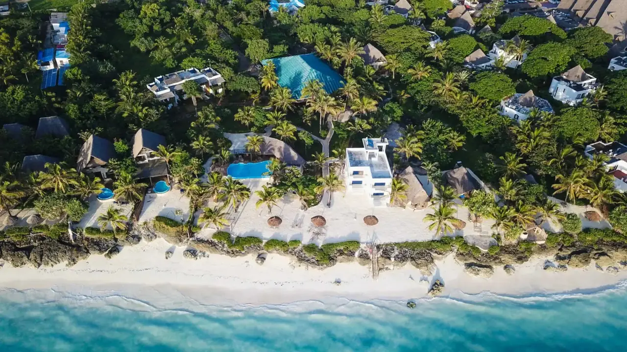 Aerial view of the hotel's gardens and buildings along the coast