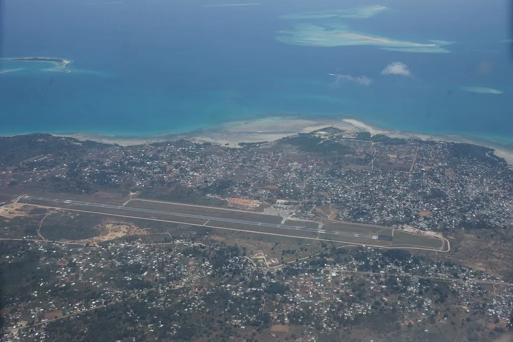 Aerial view of the airport runway with Zanzibar Town and the coast beyond