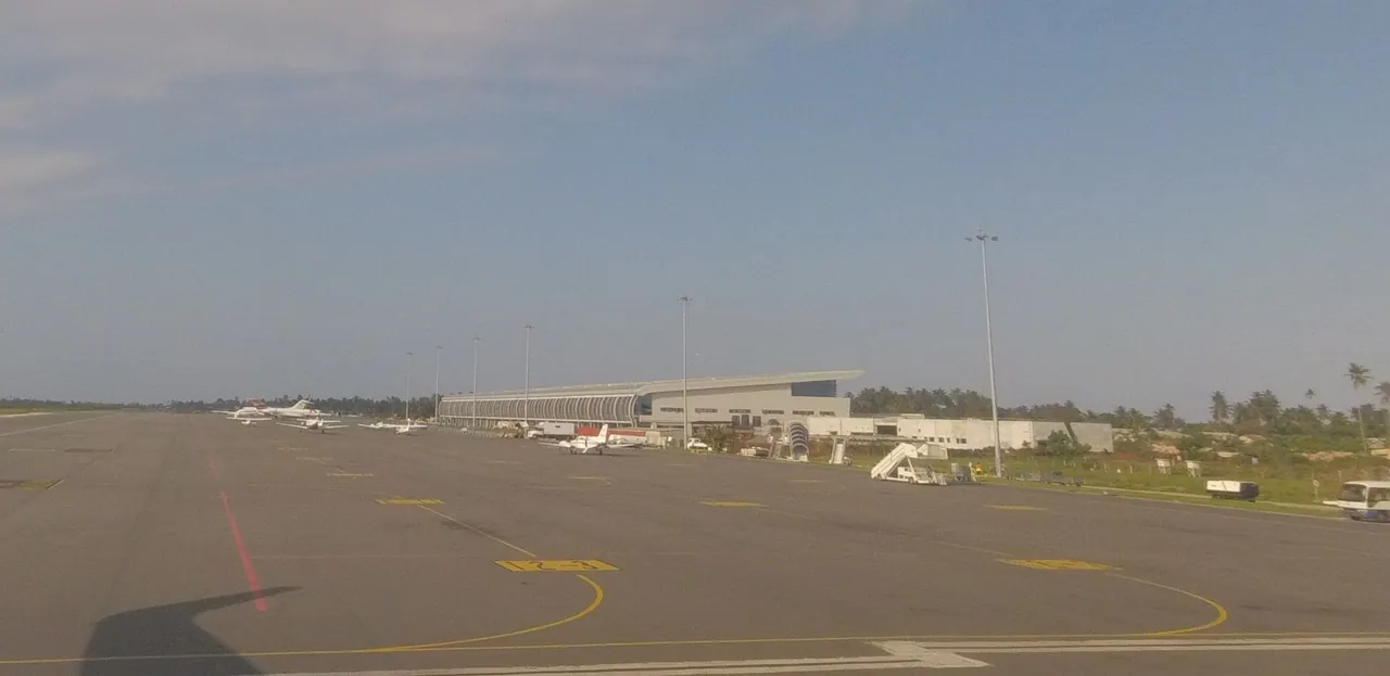 View across the airport apron towards a distant terminal building