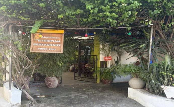 Entrance to the Abyssinian Ethiopian restaurant under trees